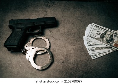 Criminal Money. Pistol. Handcuffs And Dollar Bills. Top View. Mafia And Corruption Concept. Black Money And Protection