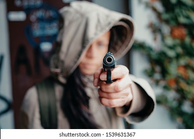 Criminal murder holding a gun