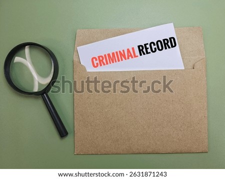 Criminal Record Document in Brown Envelope with Black Magnifying Glass – Concept of Background Check, Legal Investigation, Crime Report, Privacy Breach, and Law Enforcement. 