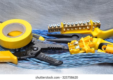 Crimping tool component and cables on grey background with place for text - Powered by Shutterstock