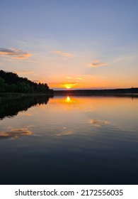 Crimson Sunset Over The Lake