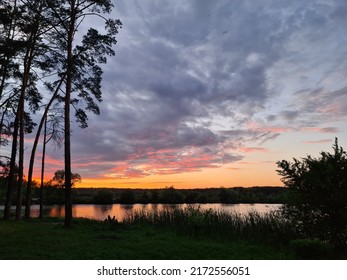 Crimson Sunset Over The Lake