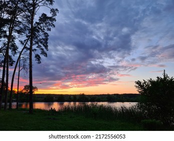 Crimson Sunset Over The Lake