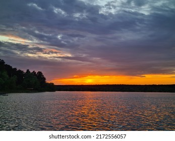 Crimson Sunset Over The Lake