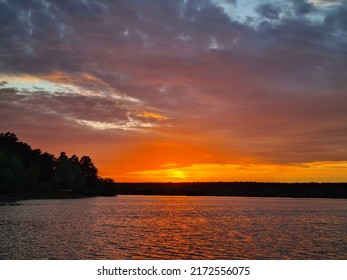 Crimson Sunset Over The Lake