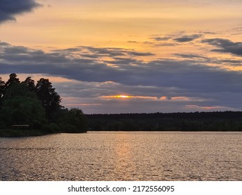 Crimson Sunset Over The Lake