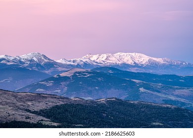 Crimson Sunset Sky On The High Mountain Range.