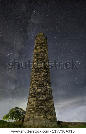 Cringles Tower in Northern England. With a backdrop of the Milky Way
