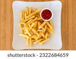 Crinkle cut french fries with ketchup