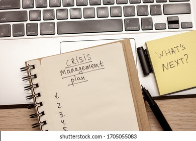 Crisis Management Plan Hand Written Words In Notebook