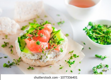 Crisp Bread Healthy Snack With Salmon, Cottage Cheese, Cucumber Stripes, Thyme And Pepper. Easy Breakfast Concept Close-up With Copy Space.