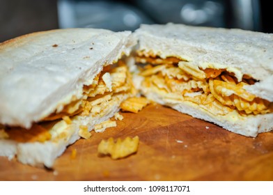 A Crisp Sandwich Comprising A Packet Of Ridged Crisps Inside Two Slices Of Plain Or Batch Bread (including The Heel, Which Everyone Knows Is The Best Part).