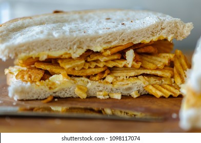 A Crisp Sandwich Comprising A Packet Of Ridged Crisps Inside Two Slices Of Plain Or Batch Bread (including The Heel, Which Everyone Knows Is The Best Part).