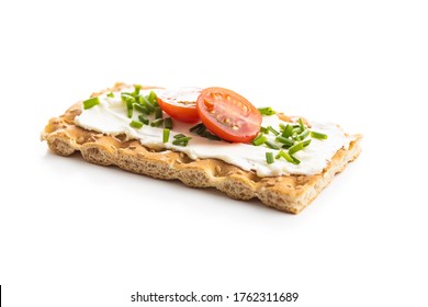 Crispbread with creamy cheese, chive and cherry tomatoes isolated on white background. - Powered by Shutterstock