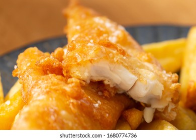 Crispy Battered Fish And Chips On Plate