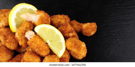 Crispy Breadcrumb Covered Fried Scampi On A Slate Background