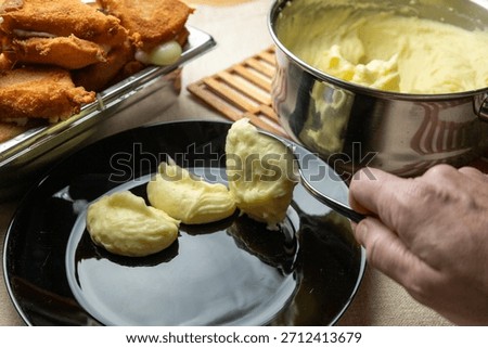 Crispy breaded cheese with smashed potato