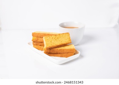 Crispy cake rusk and steaming tea