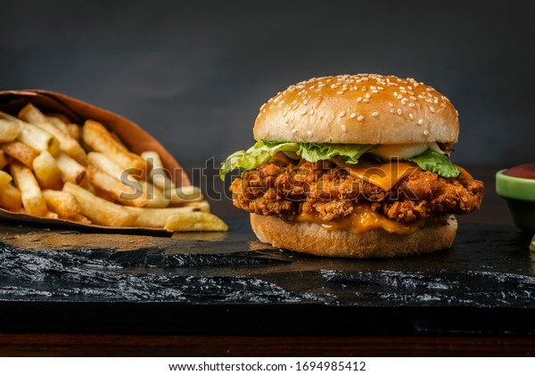 crispy cheese chicken patty burger with fries and\
dips meal