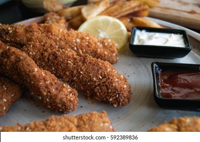 Crispy Chicken Fingers With French Fires, Ketchup And Mayonnaise