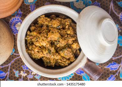 Crispy Chicken Rendang Or Asian Curry Rendang In The Clay Pot And Its Verry Popular Food In Malay Culture During Festival And Celebration.