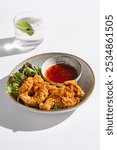 Crispy Chicken Strips with Sweet Chili Sauce Vibrant Culinary Presentation in Natural Light.