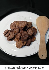 Crispy Chocolate Banana Chips On A White Plate