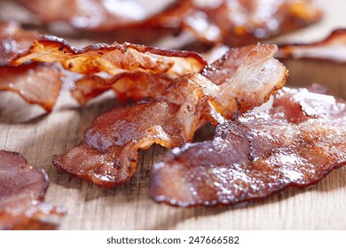 Crispy Cooked Bacon On Wooden Table, Close Up