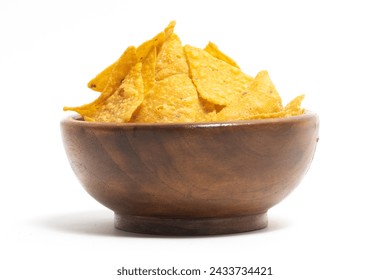 Crispy corn tortilla nachos chips in a wooden bowl isolated on white background clipping path - Powered by Shutterstock