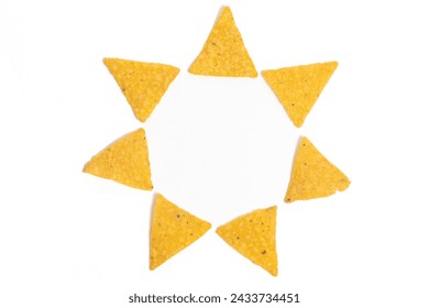 Crispy corn tortilla nachos chips photo concept of star circle formation isolated on white background clipping path