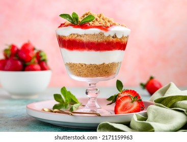 Crispy Creamy Strawberry Trifle In A Glass . Delicious Summer Dessert Of Shortbread Crumbs, Yogurt Quark Cream And Strawberries. Selective Focus