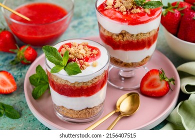 Crispy Creamy Strawberry Trifle In A Glasses. Delicious Summer Dessert Of Shortbread Crumbs, Yogurt Quark Cream And Strawberries. Selective Focus