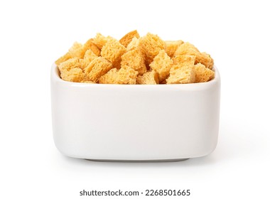 Crispy croutons in bowl isolated on white background with clipping path