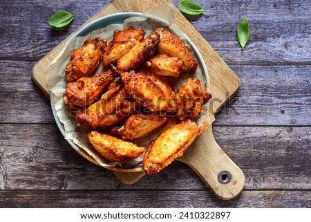 
 Crispy  deep fried   chicken 
 wings with cornflakes , ketchup and french fries . Breaded  with cornflakes chicken   wings. Junk fast food