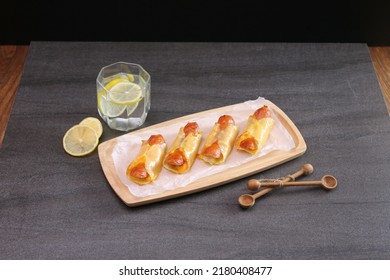 Crispy Dumpling Hot Dog Roll Dumpling Wrapper Cheese Mini Sausages Bake Snack Finger Food Party Food With Lemonade Wooden Tray On Table Bite Size