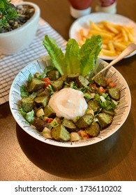 Crispy Falafels Diced And Tossed In A Salad Filled With Lettuce, Olives, Tomatoes Drizzled With Lemon Dressing Finally Topped With A Dollop Of Garlic Mayonnaise. Served With A Side Of French Fries.