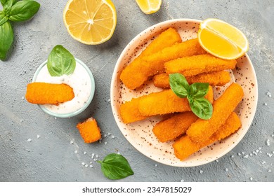 crispy fish steak, fish fingers served with tar tar sauce on a light background. banner, menu, recipe place for text, top view.