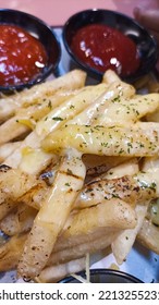 Crispy French Fries Stuffed With Cream Sauce And Mozzarella Cheese And A Sprinkling Of Oregano Powder, Served With Chili Sauce, Cheese Sauce.