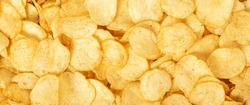 Crispy Fresh Potato Chips, Snacks Background. Top View, Flat Lay. Banner