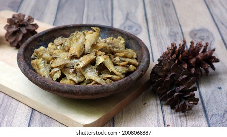 Crispy Fried Baby Fish On A Clay Plate.