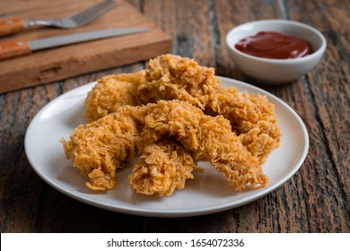 Crispy Fried Breaded Chicken Strips On Plate And Ketchup