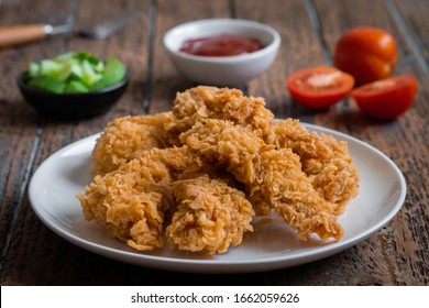 Crispy Fried Breaded Chicken Strips On Plate And Ketchup