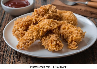 Crispy Fried Breaded Chicken Strips On Plate And Ketchup