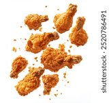 Crispy fried chicken pieces in mid-air with crumbs scattering isolated