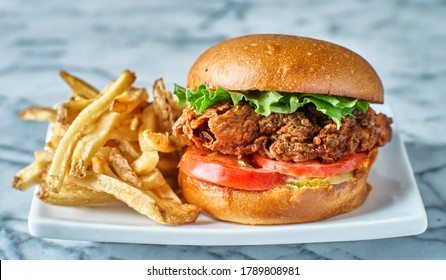 Crispy Fried Chicken Sandwich On Brioche Bun With French Fries