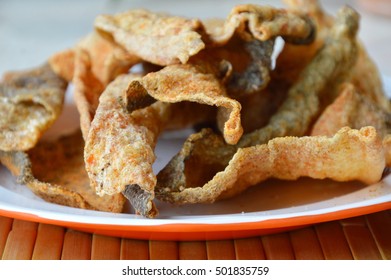 Crispy Fried Fish Skin With Seasoning On Dish