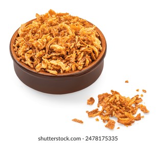 Crispy fried onion flakes in a bowl  isolated on white background. Crunchy Scattered Dry Onion Pieces close up
 - Powered by Shutterstock