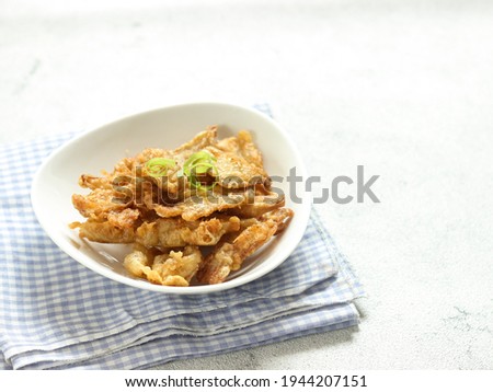 Crispy Fried Oyster Mushroom or Jamur Krispi. Oyster Mushroom Coated with Spiced Flour and Depp Fried. Usually Served with Tomato Sauce. Selective focus