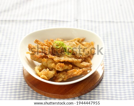 Crispy Fried Oyster Mushroom or Jamur Krispi. Oyster Mushroom Coated with Spiced Flour and Depp Fried. Usually Served with Tomato Sauce. Selective focus