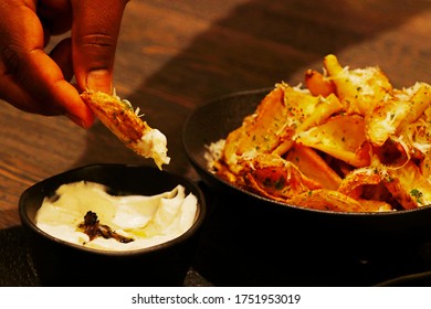 crispy fried potato chips or wedges with truffle cream dip - Powered by Shutterstock